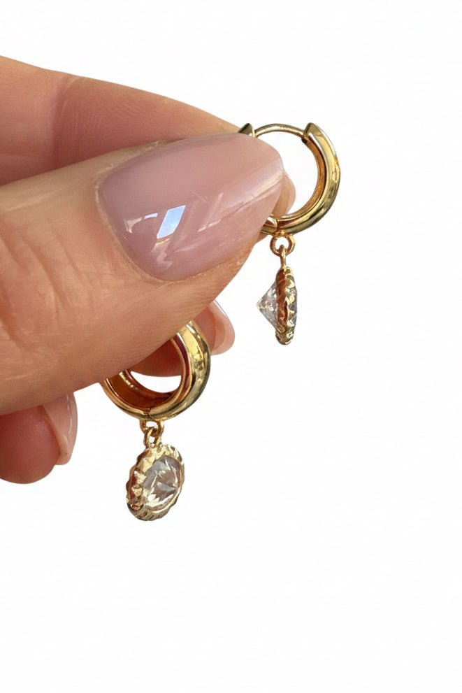 Sparkly rounds on Gold Huggies